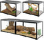 Glass reptile terrariums with secure doors, natural wood branches, plants, and substrate.