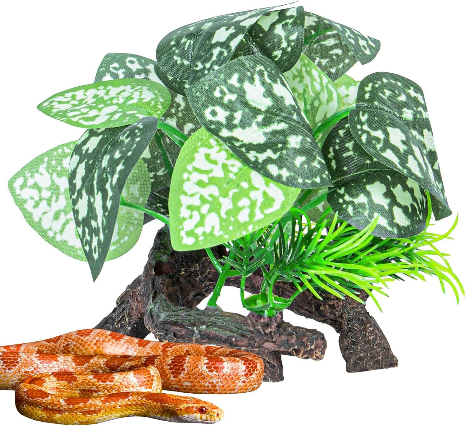 Artificial reptile terrarium plant decoration with a small orange snake resting beneath