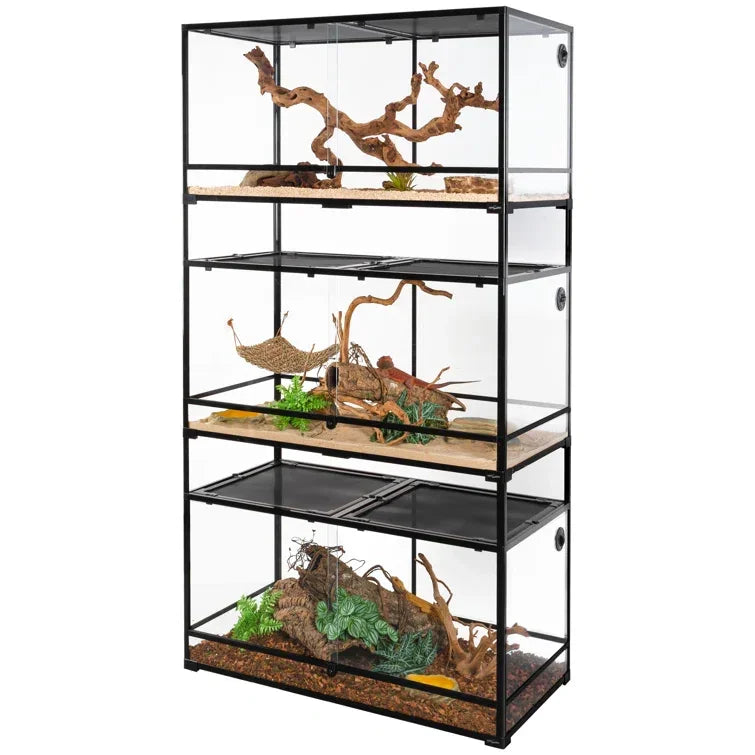 Stacked glass reptile terrariums with climbing branches, plants, and naturalistic decor Main image