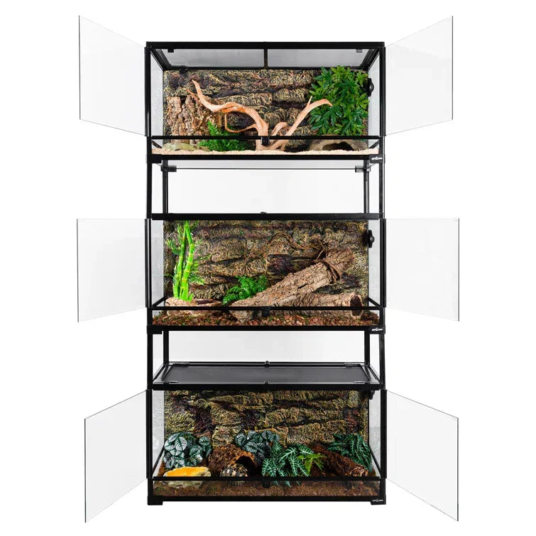 Stacked reptile terrariums with glass doors, natural decor, and branch backgrounds