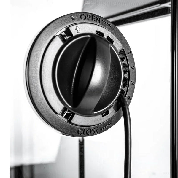 Close-up of adjustable ventilation knob with cable on a glass reptile terrarium enclosure
