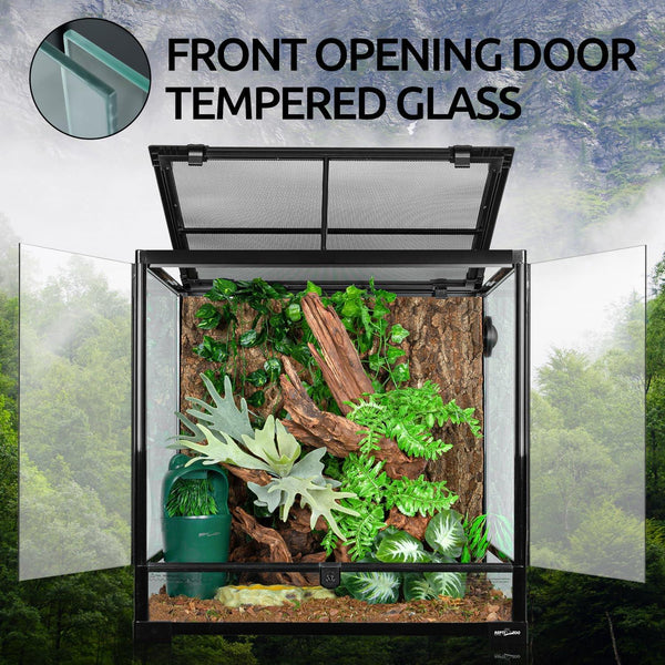 Front opening tempered glass reptile terrarium with plants, bark, and mesh top.