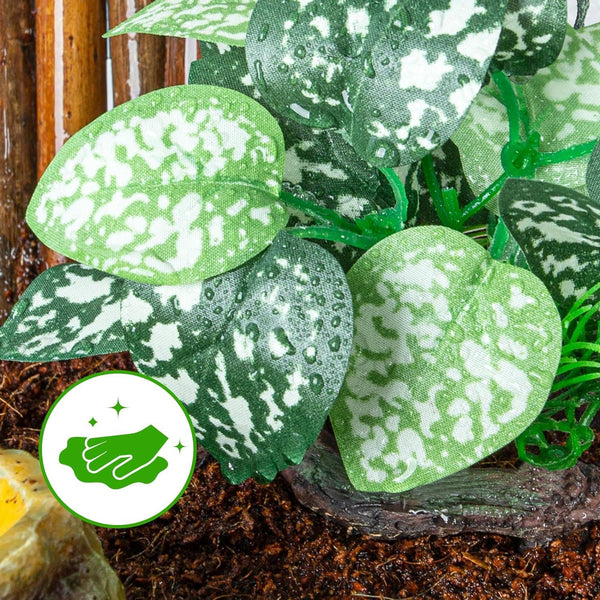 Artificial variegated reptile terrarium plant with water droplets on green leaves, easy to clean symbol
