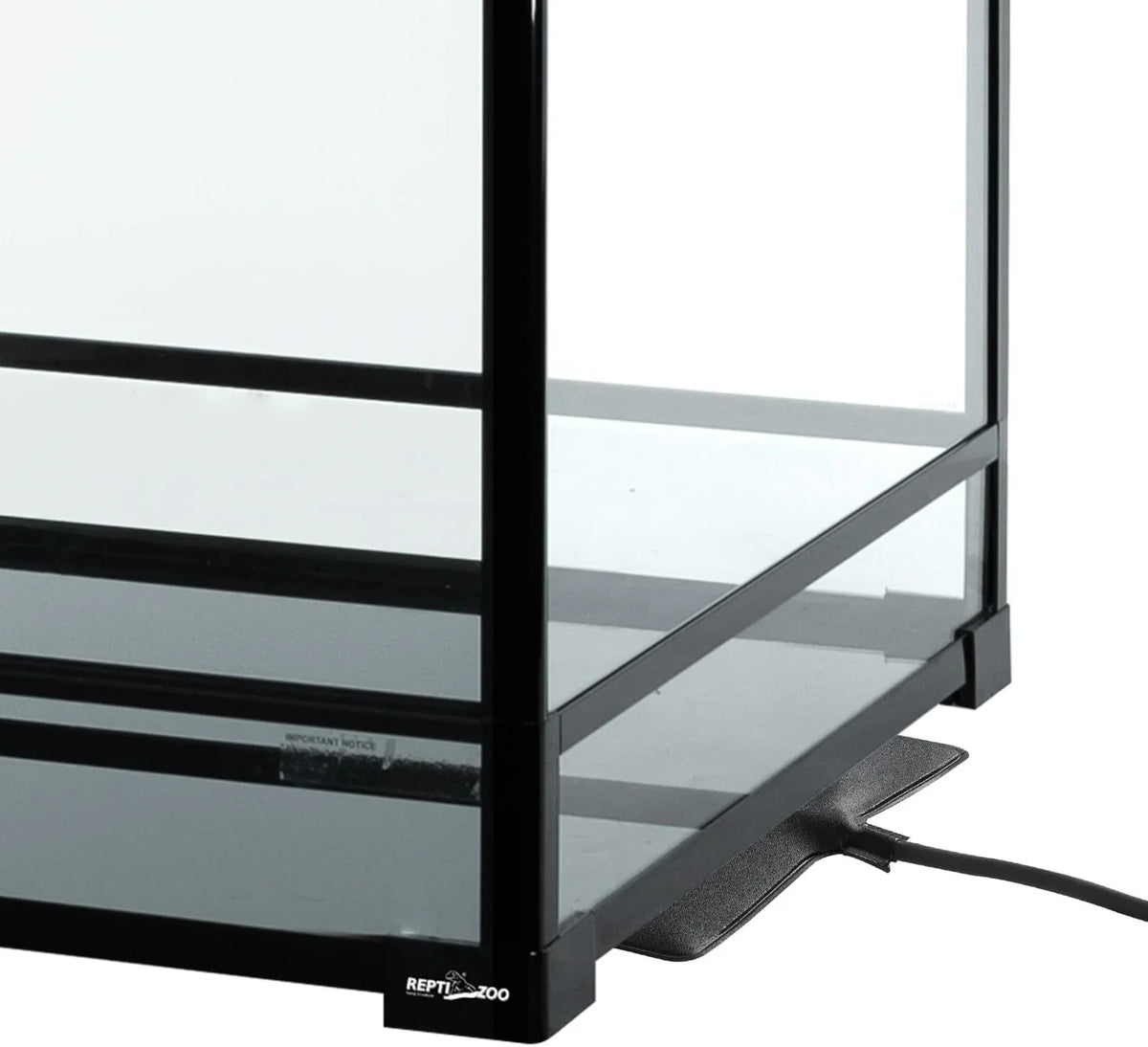 Glass reptile terrarium with heating pad and black frame, ideal for reptiles