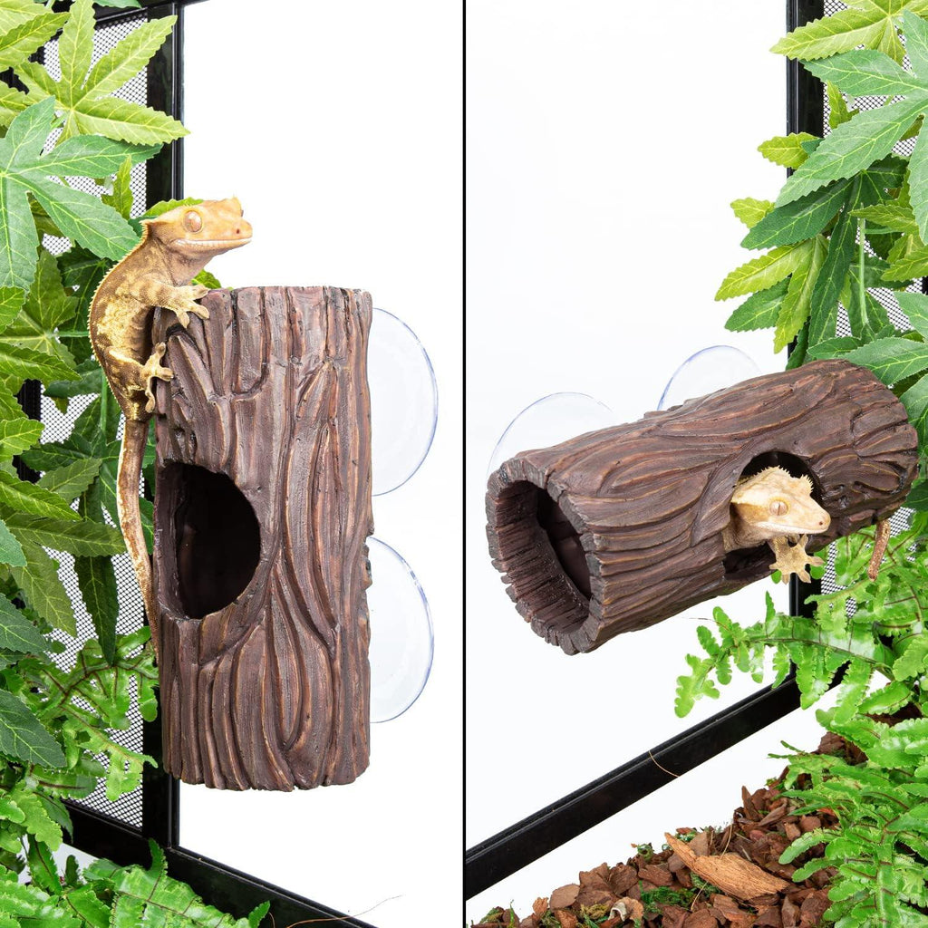 Gecko climbing and hiding in a faux wood reptile hideout attached to terrarium glass