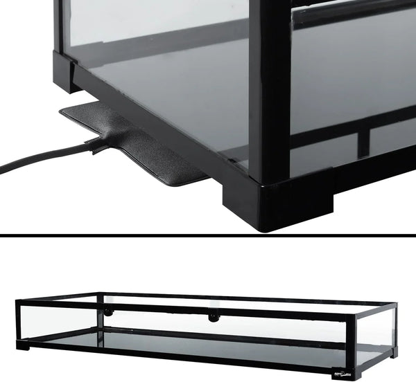 Glass reptile terrarium with black frame and under-tank heating pad installed