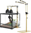 Adjustable lamp stand with dual dome heat lamps next to a glass reptile terrarium setup