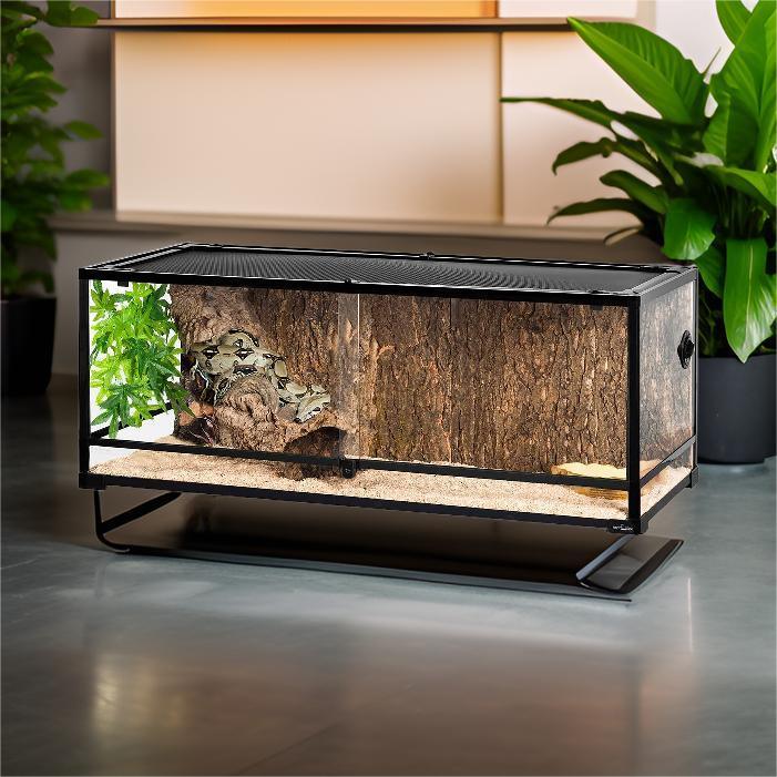 67 gallon glass reptile terrarium with screen top, natural decor, and sand substrate