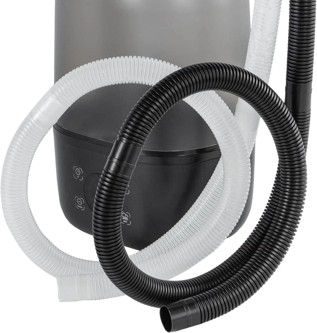 Reptile terrarium humidifier with flexible black and white hoses, close-up view