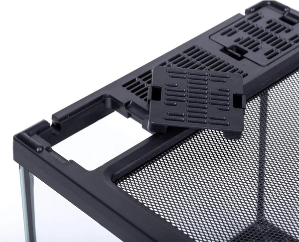 Close-up of reptile terrarium with black mesh top and removable ventilation panel