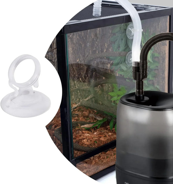 Reptile terrarium humidifier with attached hose, suction cup clip, and glass enclosure.
