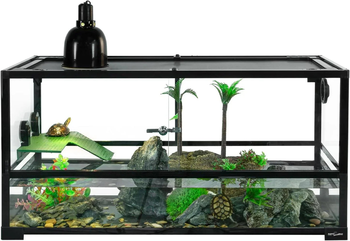 Glass reptile terrarium with UVB heat lamp, turtles, rocks, plants, and basking platform