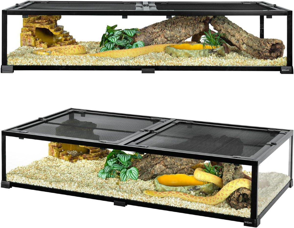 Large reptile terrarium with mesh lid, logs, hide, plants, and substrate, housing a yellow snake.