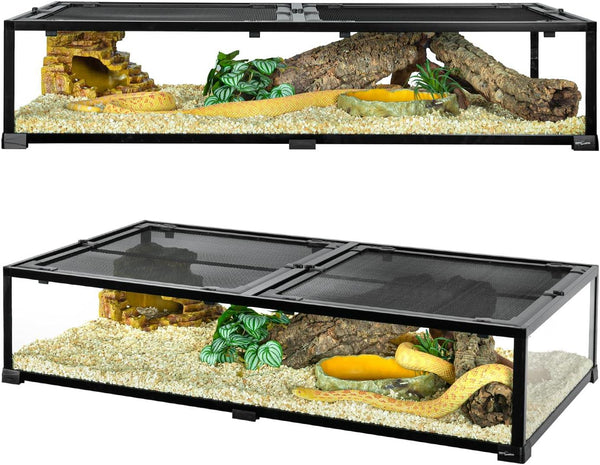 Large reptile terrarium with mesh lid, logs, hide, plants, and substrate, housing a yellow snake.