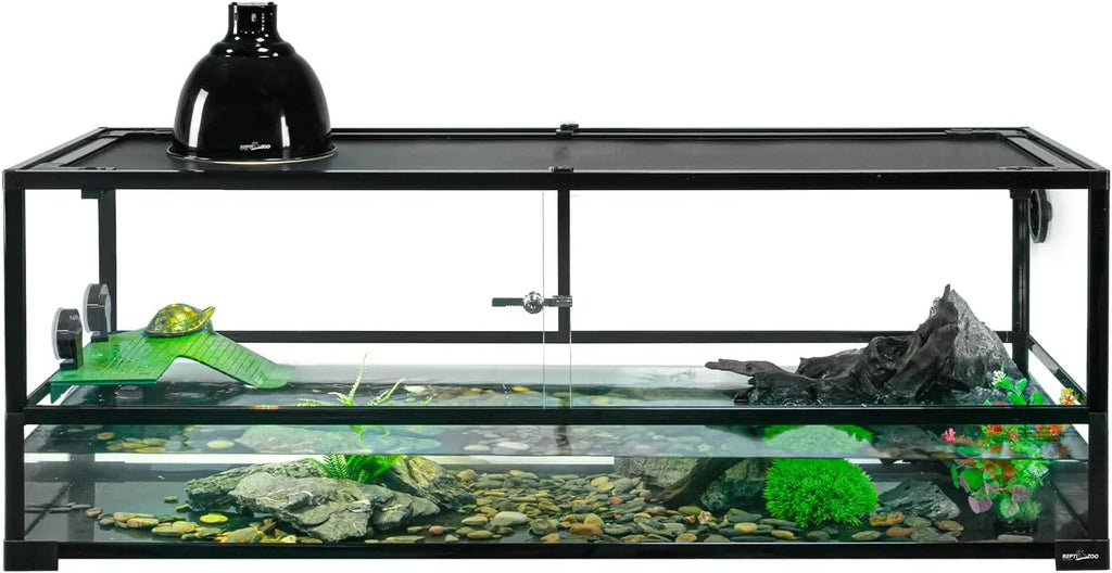 Glass reptile terrarium with UVB heat lamp, turtle basking ramp, rocks, and aquatic plants