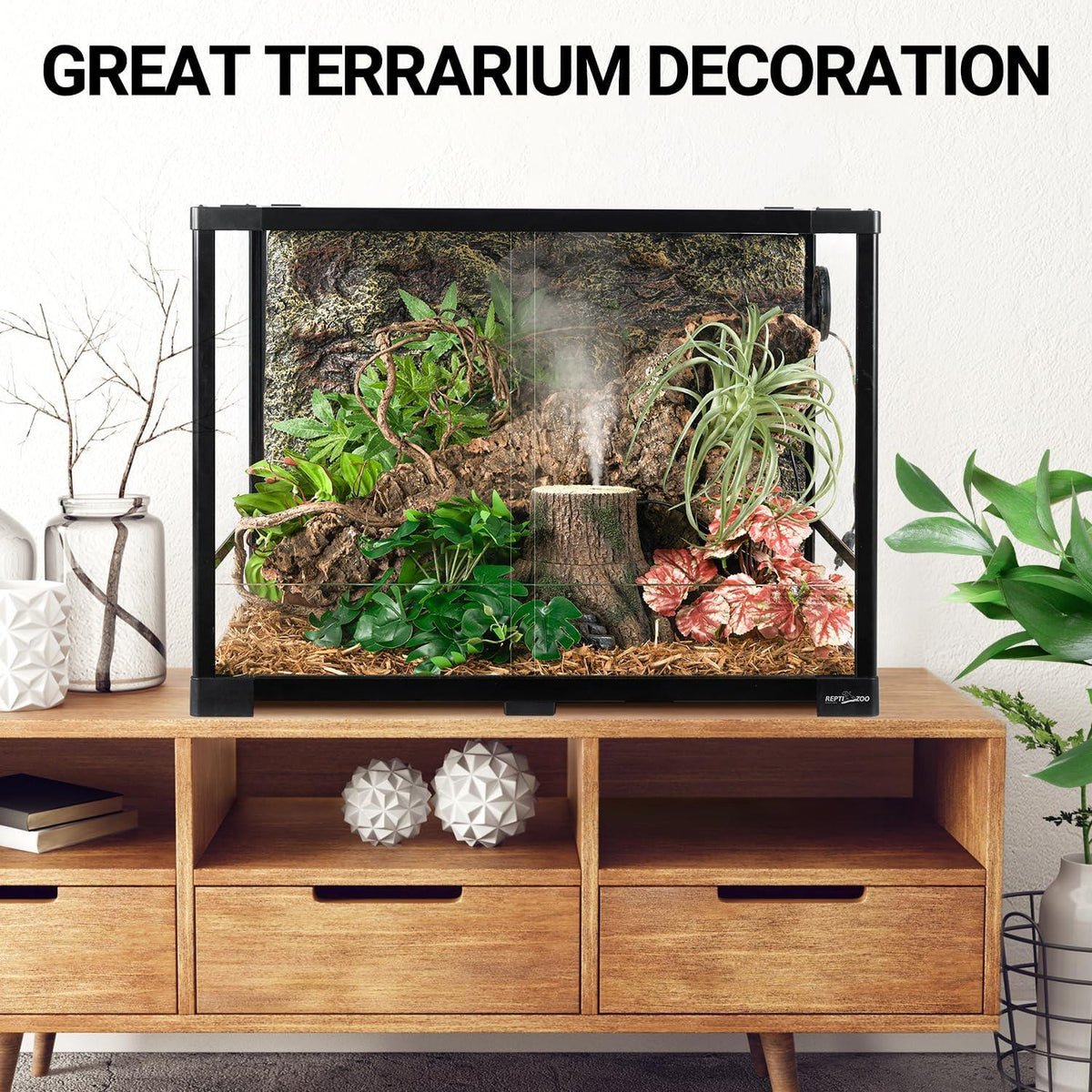 Glass reptile terrarium with lush plants, wood, and mist on wooden cabinet, living room decor