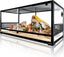 Large glass reptile terrarium with sliding doors, sand substrate, rocks, and a yellow lizard.