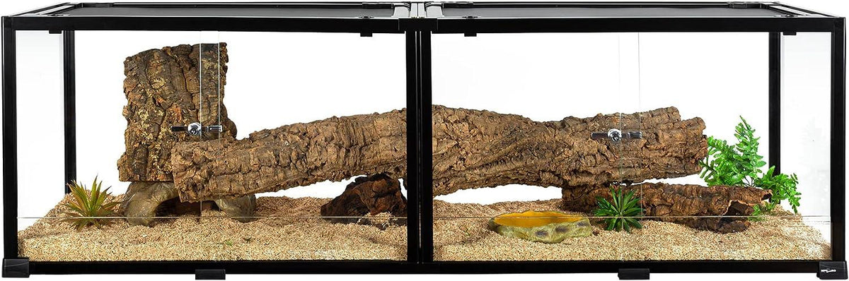 Glass reptile terrarium with cork log hide, plants, and sand substrate for reptiles