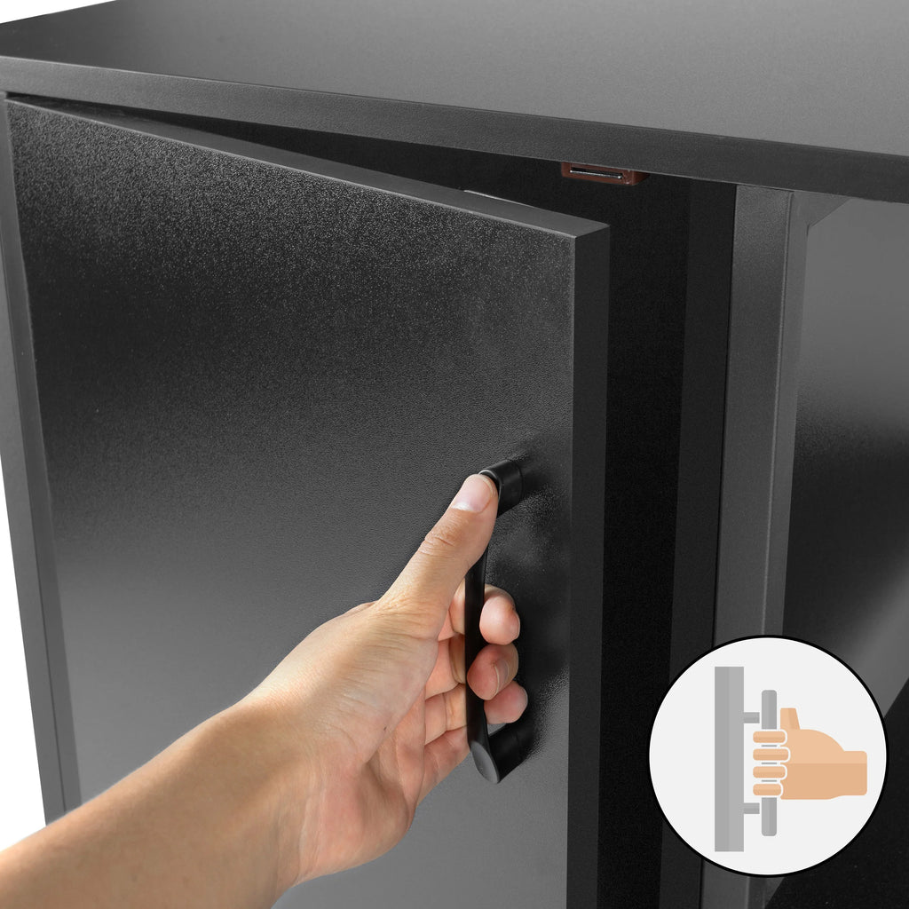 Hand opening black reptile terrarium cabinet with handle, close-up view