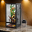 Mesh reptile terrarium with chameleon, misting system, vines and wood branches