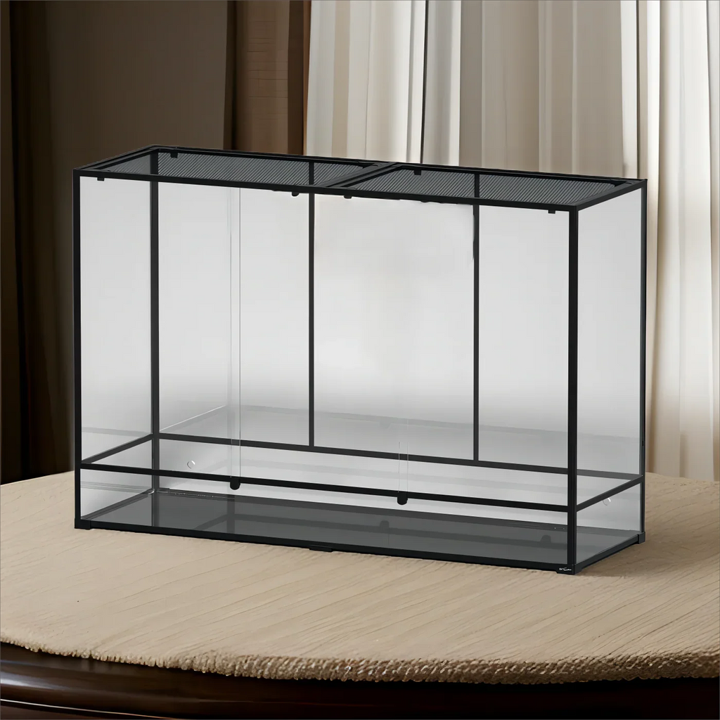 Large glass reptile terrarium with black metal frame and mesh top for ventilation