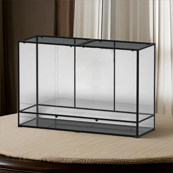Large glass reptile terrarium with black metal frame and mesh top for ventilation