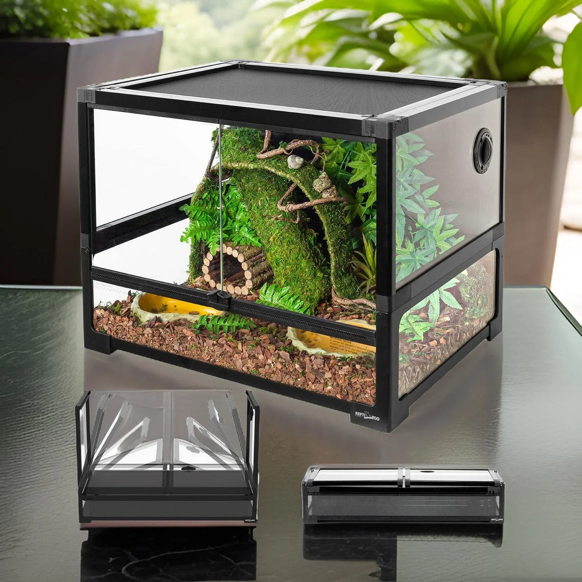 PVC reptile terrarium with front glass doors, realistic plants, and secure mesh top. Main image