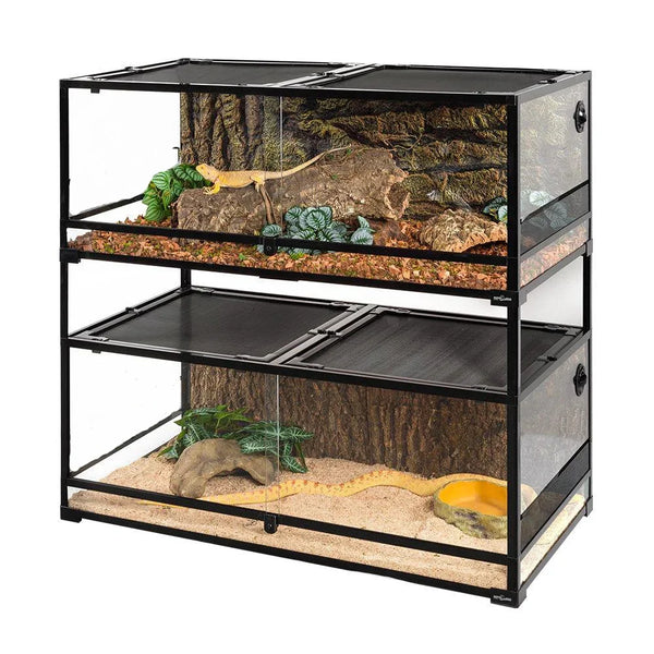 Stacked glass reptile terrarium cages with background decor, plants, and climbing branches.