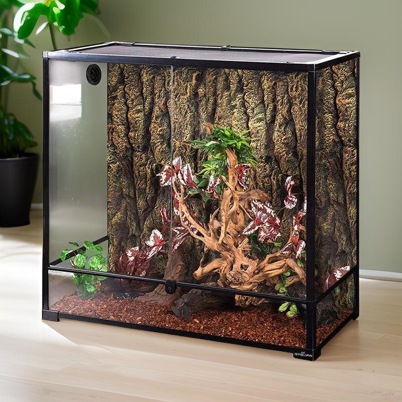Large glass reptile terrarium with natural wood, plants, and bark background, ideal for reptiles Main image