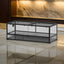 Large glass reptile terrarium with metal frame and mesh top on marble floor